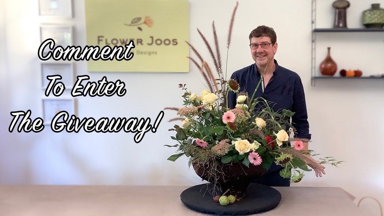 Are we cutting back? Competition time! Win these beautiful Japanese shears from Wazakura. 

Ingredients - sunflower stem with seedheads, roses, lisianthus, dahlia, sedum, mixed foliage, autumn grasses. 

It’s competition time! In todays video we use these quality japanese shears from Wazakura and all you have to do to win a pair for yourself is comment below the video! Tell us where you are, or if you liked the design, or what will you make with the shears? 
Wazakura not only supply shears and scissors but also pinholders - another great item for your toolbox. Check out this special offer - 

Wazakura first order offer! 

A kenzan is a great addition to your floral art toolbox. 
For kenzans and Japanese ikebana tools check out Wazakura in Japan. They deliver worldwide and if you follow the afgiliate link and enter  FLOWERJOOS into the promo code, you get 10% off your first purchase! 
https://wazakurajapan.com/discount/FLOWERJOOS?ref=flowerjoos

Thank you for watching today’s video - if you would like to support our channel our pay pal details are - 

https://paypal.me/flowerjoos

If you haven’t already subscribed we would love it if you do! It’s free and you can keep up with all our new designs by tapping the bell button!

If you fancy a little more creative inspiration then check out this previous video of how to create a circular bouquet with an interesting technique. 

https://youtu.be/CtBMXZKsi-s?si=WEqpeoLDc35ml2Jb

Buy your Oasis Products including wires, foams, scissors etc. here:

UK : https://www.amazon.co.uk/gp/search/ref=as_li_qf_sp_sr_il_tl?ie=UTF8&tag=flowerjoos-21&keywords=Smithers+Oasis&index=aps&camp=1634&creative=6738&linkCode=xm2&linkId=baa866facc7fc02263a7ff77a5b9adb8
US: https://www.amazon.com/gp/search/ref=as_li_qf_sp_sr_il_tl?ie=UTF8&tag=flowerjoos-20&keywords=oasis+smithers&index=aps&camp=1789&creative=9325&linkCode=xm2&linkId=aeaa2ad15baccacd9714db136955aabd

Description contains affiliate links which means we may earn a small commission if you click on the links and make a purchase.

Check out our other videos, and subscribe to our channel by clicking here : https://www.youtube.com/channel/UC0iIJtpgr4MR9lynayAI7zg?sub_confirmation=1
There's a lot more to come!

Facebook : http://facebook.com/flowerjoos
Instagram : http://instagram.com/flowerjoos
E-mail : flowerjoos@gmail.com

#flowerjoos 
#florist 
#giveaway 
#flowerarrangement