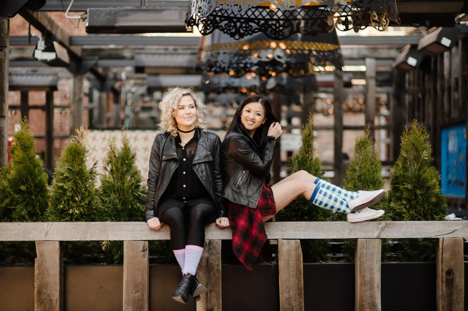 Two models wearing Flyte Sock's products