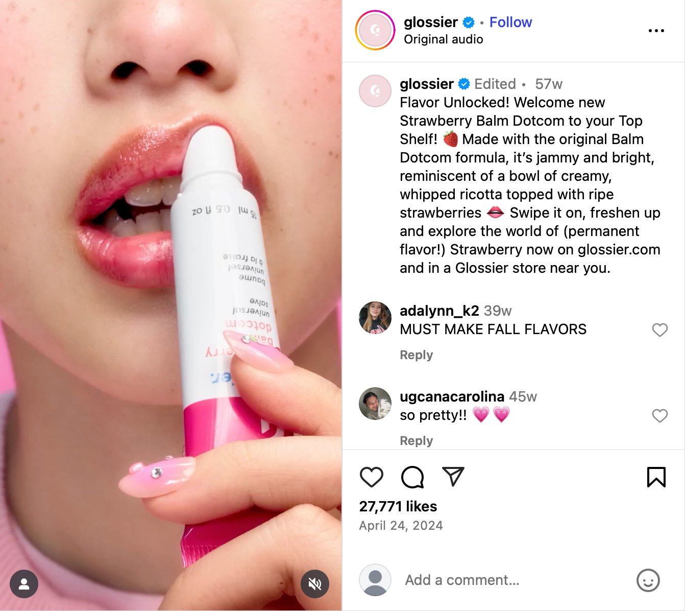 Glossier launches Strawberry Balm Dotcom as a permanent flavour Close-up of a person applying Glossier Strawberry Balm Dotcom to their lips with glossy pink nails