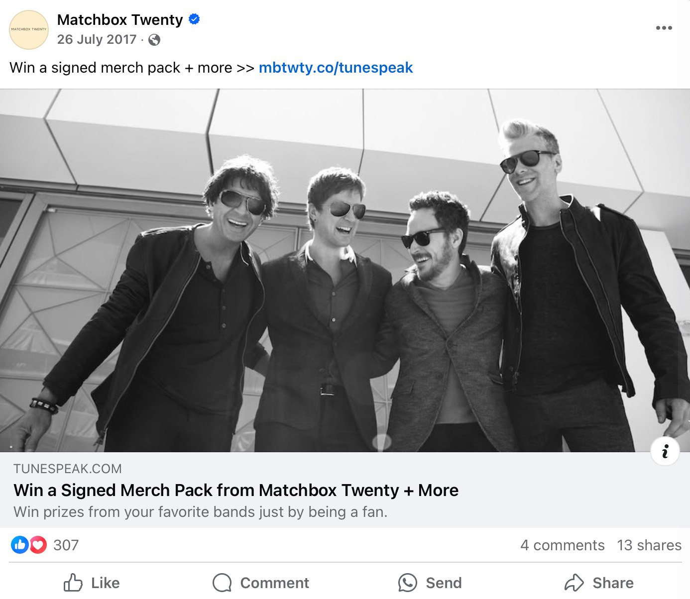 Matchbox Twenty band members laughing together in black and white photo