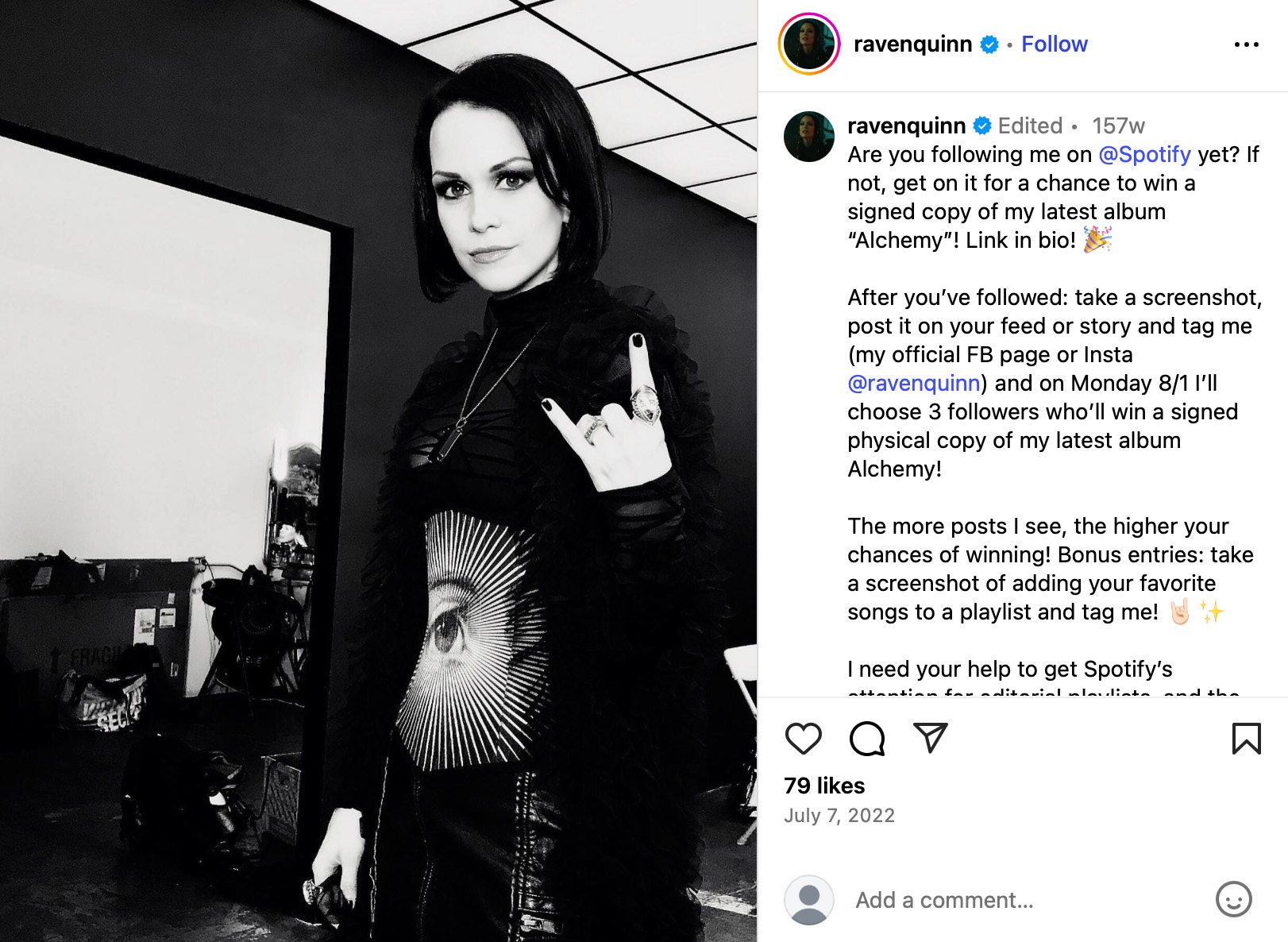 Artist Raven Quinn standing in a studio wearing black with a competition post about her Spotify giveaway