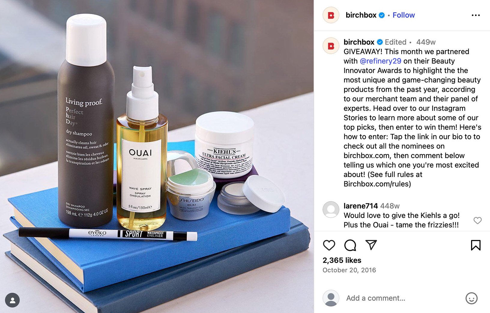 Assortment of skincare and beauty products on stacked books for Birchbox giveaway