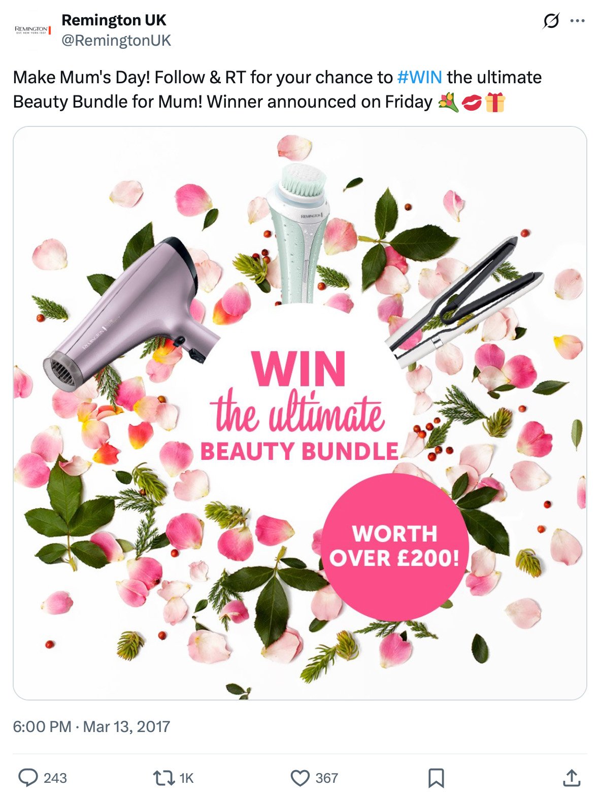 Hair dryer, brush, and straightener surrounded by rose petals with giveaway details
