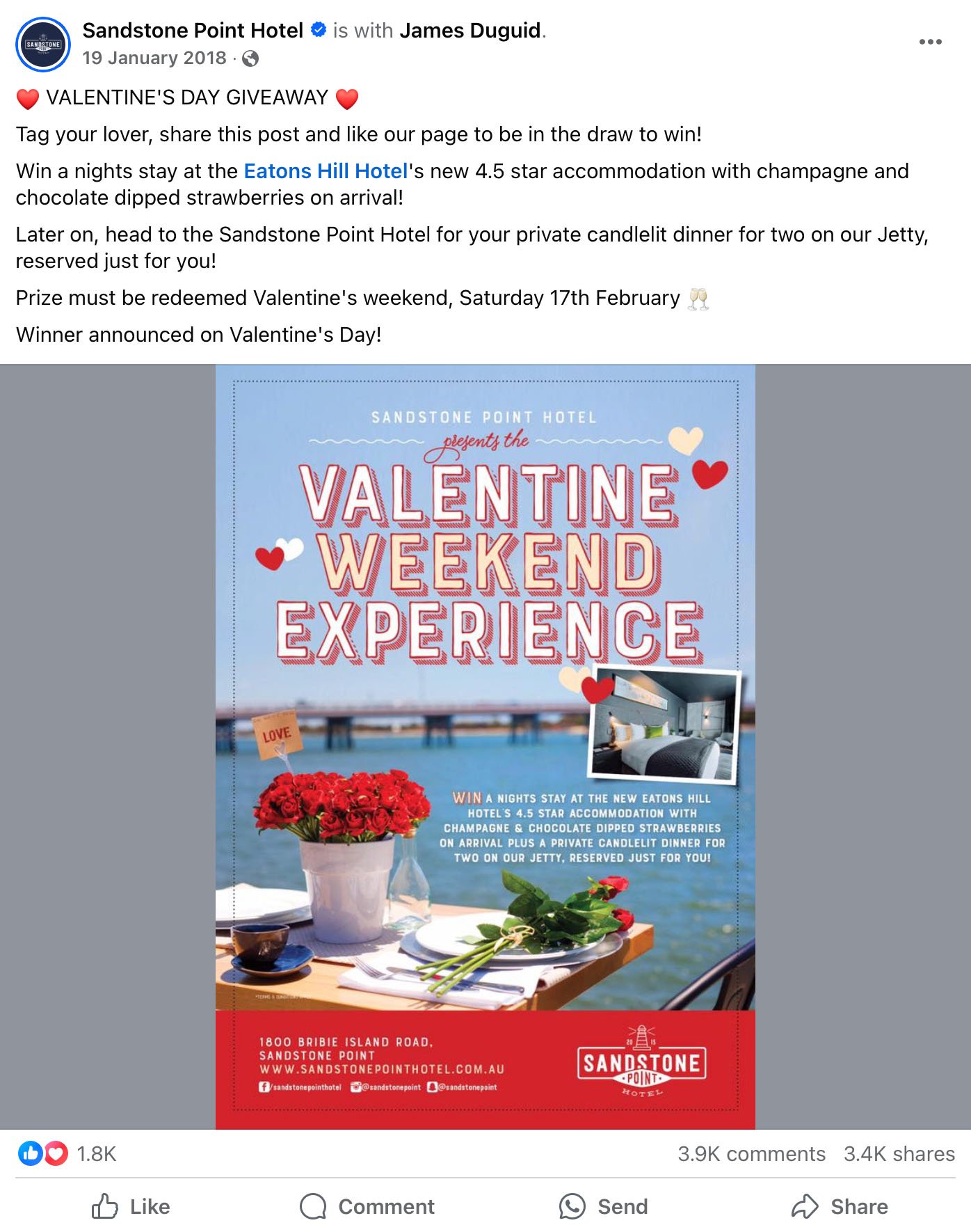 Table set for two with red roses by the water advertising Valentine's Day giveaway