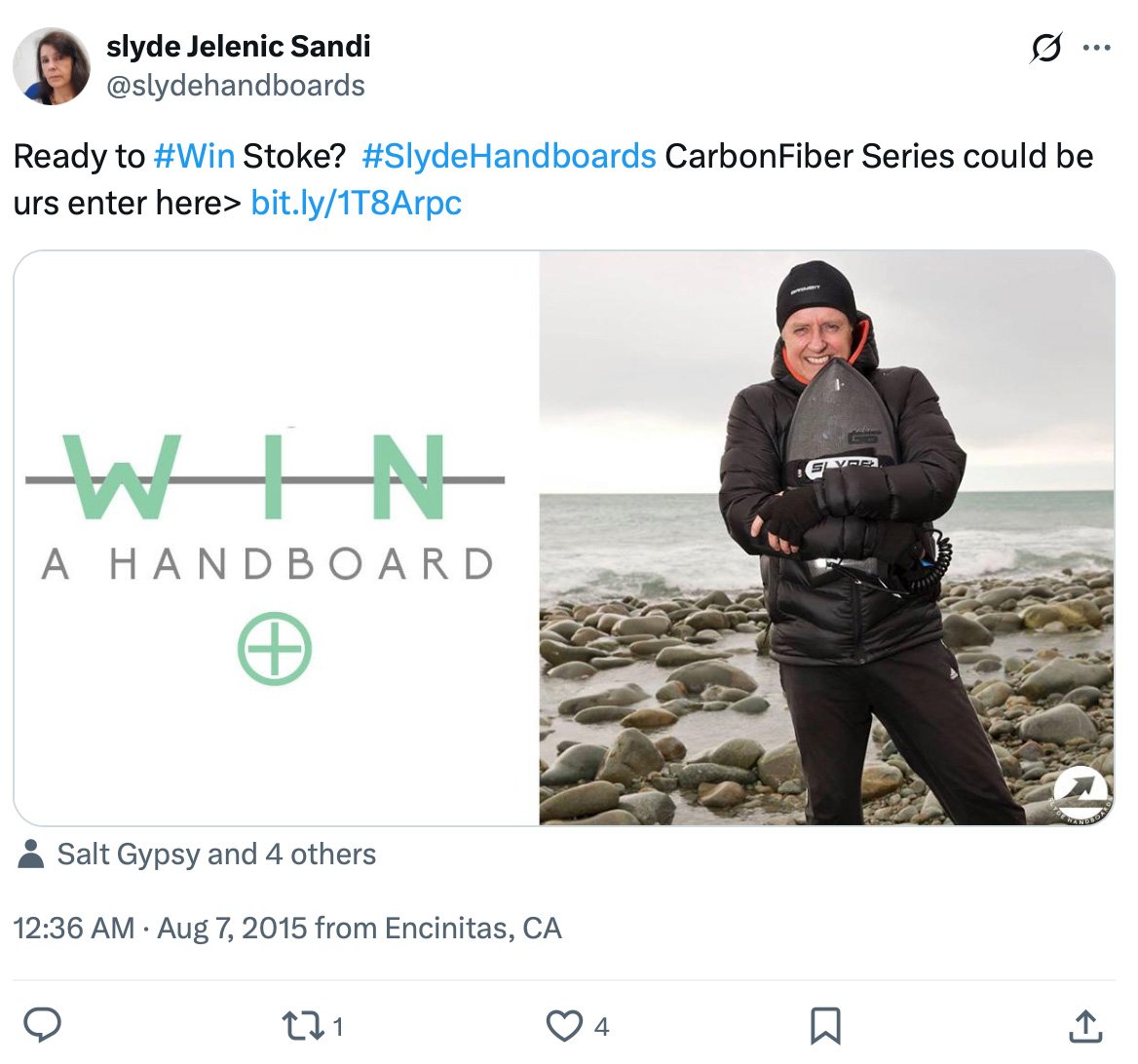 Slyde Handboards giveaway for CarbonFiber series Giveaway post featuring a man on a rocky beach holding a Slyde Handboard with text promoting a chance to win