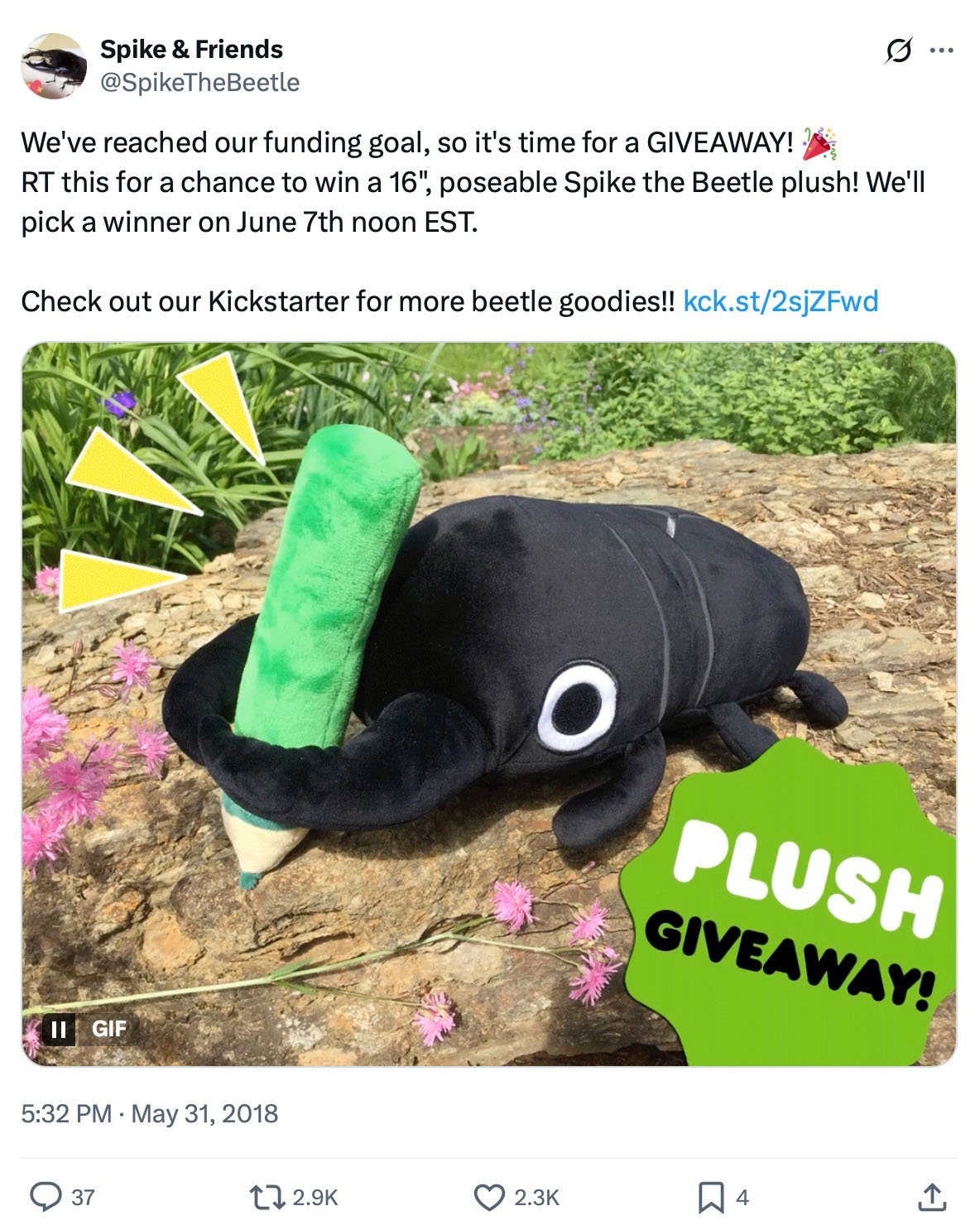 Spike the Beetle celebrates Kickstarter goal with plush giveaway Spike the Beetle plush holding a green crayon with 'Plush Giveaway' text overlay